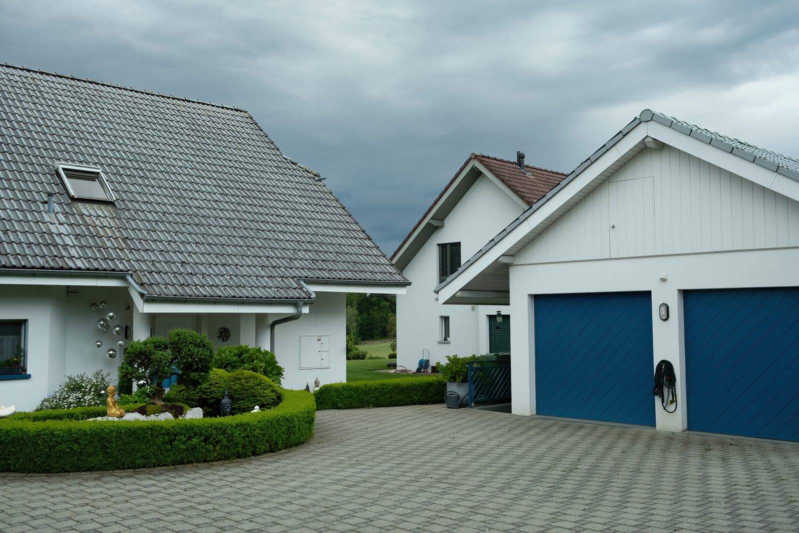 An interlocking paver driveway running up to a house